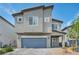 Charming two-story home with a two-car garage and well-maintained landscaping at 9876 Magnus Ct, Las Vegas, NV 89178