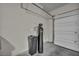 Garage view showcasing water softener system and door at 9876 Magnus Ct, Las Vegas, NV 89178