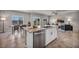 Open concept kitchen with granite countertops, stainless steel appliances, and island at 9876 Magnus Ct, Las Vegas, NV 89178