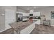 Bright kitchen featuring granite countertops, stainless steel appliances, and white cabinets at 9876 Magnus Ct, Las Vegas, NV 89178