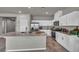 Modern kitchen with a large island, stainless steel appliances, and ample cabinet space at 9876 Magnus Ct, Las Vegas, NV 89178