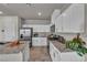 Modern kitchen with stainless steel appliances, white cabinets, and granite countertops at 9876 Magnus Ct, Las Vegas, NV 89178