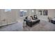 Spacious carpeted living room with ample natural light and stylish decor at 9876 Magnus Ct, Las Vegas, NV 89178