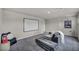 Open living area featuring modern decor, a couch and a screen at 9876 Magnus Ct, Las Vegas, NV 89178