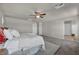 Spacious main bedroom features a ceiling fan, ensuite bathroom, and neutral carpeting at 9876 Magnus Ct, Las Vegas, NV 89178