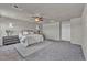 Serene main bedroom with soft carpet, ceiling fan, and minimalist decor at 9876 Magnus Ct, Las Vegas, NV 89178