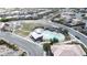 Beautiful aerial view of community pool and playground in a well-maintained neighborhood at 10212 Cider Mill Rd, Las Vegas, NV 89135