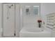 Well-lit bathroom with a bathtub, shower, and modern fixtures at 10212 Cider Mill Rd, Las Vegas, NV 89135