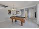 Spacious game room featuring a pool table, neutral color palette, and ample natural light at 10212 Cider Mill Rd, Las Vegas, NV 89135