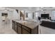 Open kitchen layout connecting to a dining area and a living room with comfortable seating at 10212 Cider Mill Rd, Las Vegas, NV 89135