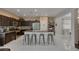 Spacious kitchen features an island with bar stool seating and stainless steel appliances at 10212 Cider Mill Rd, Las Vegas, NV 89135