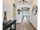 Inviting foyer featuring wood-look floors and views of the dining area and stylish decor at 10456 Skye Arroyo Ave, Las Vegas, NV 89166