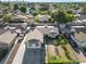 This aerial view showcases the property's layout within a quiet residential neighborhood with lush greenery and city views at 1105 Declaration Dr, Las Vegas, NV 89110