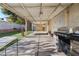 Spacious covered back patio perfect for outdoor dining and entertaining with a well maintained lawn at 1105 Declaration Dr, Las Vegas, NV 89110