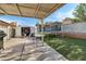 The backyard has a trampoline, artificial grass, a storage shed, and a covered patio at 1105 Declaration Dr, Las Vegas, NV 89110