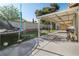 This backyard has a trampoline, artificial grass, covered patio, and a grill at 1105 Declaration Dr, Las Vegas, NV 89110