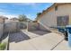 An enclosed concrete backyard space offering privacy and functionality with easy access through a metal gate at 1105 Declaration Dr, Las Vegas, NV 89110