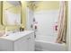 Bright bathroom featuring a shower-tub combo and a mirrored sink at 1105 Declaration Dr, Las Vegas, NV 89110