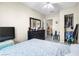 Bright bedroom features a closet, door and a large dark-stained dresser at 1105 Declaration Dr, Las Vegas, NV 89110