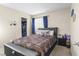 Cozy bedroom featuring a comfortable bed, neutral walls, and a walk-in closet at 1105 Declaration Dr, Las Vegas, NV 89110