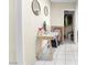 Hallway with a table, round mirrors, and tiled floor at 1105 Declaration Dr, Las Vegas, NV 89110
