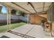 This covered patio overlooks a green backyard with artificial grass and a small storage shed at 1105 Declaration Dr, Las Vegas, NV 89110