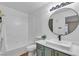 Bathroom with shower and tub combination and vanity with a vessel sink and green cabinets at 1150 N Buffalo Dr # 2025, Las Vegas, NV 89128