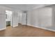 Spacious bedroom with hardwood floors and ensuite bathroom boasts lots of natural light and a walk-in closet at 1150 N Buffalo Dr # 2025, Las Vegas, NV 89128