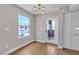 The dining area features hardwood floors, a modern light fixture, and balcony access at 1150 N Buffalo Dr # 2025, Las Vegas, NV 89128