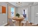 Modern dining area featuring a round table, seating for four, and stylish light fixture at 1150 N Buffalo Dr # 2025, Las Vegas, NV 89128