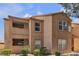 Exterior view of a well-maintained two-story building with balconies at 1150 N Buffalo Dr # 2025, Las Vegas, NV 89128