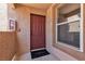 Unit front door with welcome mat, fire extinguisher and window in a secure access building at 1150 N Buffalo Dr # 2025, Las Vegas, NV 89128