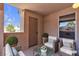 Cozy patio with comfortable seating, potted plants, and a charming outdoor ambiance at 1150 N Buffalo Dr # 2025, Las Vegas, NV 89128