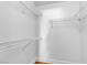 A walk-in closet features ample shelving for organization and storage, providing an efficient solution for wardrobe management at 1150 N Buffalo Dr # 2025, Las Vegas, NV 89128
