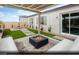 Cozy backyard with a fire pit, seating, and covered patio area at 121 Piano Ln # Lot 198, Henderson, NV 89015