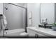 Modern bathroom with a shower-tub combo, stylish wallpaper, and modern fixtures at 121 Piano Ln # Lot 198, Henderson, NV 89015