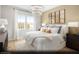 Comfortable bedroom featuring neutral tones, soft textures, and abundant natural light at 121 Piano Ln # Lot 198, Henderson, NV 89015