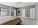 Large bedroom featuring gray walls, neutral carpeting, recessed lighting, and two closets at 13 Dovetail Cir, Henderson, NV 89014