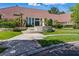 Stunning home featuring a red tile roof, well-manicured lawn, and attractive stone accents at 13 Dovetail Cir, Henderson, NV 89014