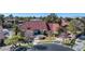 Expansive single-story home featuring a red tile roof, circular driveway and manicured landscaping in a desert community at 13 Dovetail Cir, Henderson, NV 89014