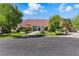 Beautiful single story home with well-manicured lawn, mature trees, and an oversized red tile roof at 13 Dovetail Cir, Henderson, NV 89014