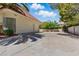 Attached two-car garage with a spacious driveway and a well-maintained lawn and landscaping at 13 Dovetail Cir, Henderson, NV 89014