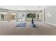 Spacious gym featuring a large window with carpet flooring providing an elegant look at 13 Dovetail Cir, Henderson, NV 89014