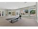 Spacious gym featuring a large window and neutral walls with an elegant look at 13 Dovetail Cir, Henderson, NV 89014