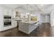 Spacious kitchen with stainless steel appliances, granite countertops, a large island, and stylish bar stool seating at 13 Dovetail Cir, Henderson, NV 89014