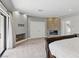 The main bedroom features a stone fireplace, neutral carpeting, recessed lighting, and a sliding glass door at 13 Dovetail Cir, Henderson, NV 89014
