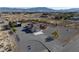 Expansive property featuring a home with an attached garage, pool, and mountain views at 1361 Moose St, Pahrump, NV 89048