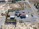 View of a large lot with a pool, garage, outbuildings, and landscaping, all nicely appointed at 1361 Moose St, Pahrump, NV 89048