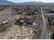 Real estate lot with pool, garage, landscaping, and outbuildings, surrounded by desert at 1361 Moose St, Pahrump, NV 89048