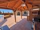 This barbecue area has outdoor workspace and access to the above ground pool and covered patio at 1361 Moose St, Pahrump, NV 89048